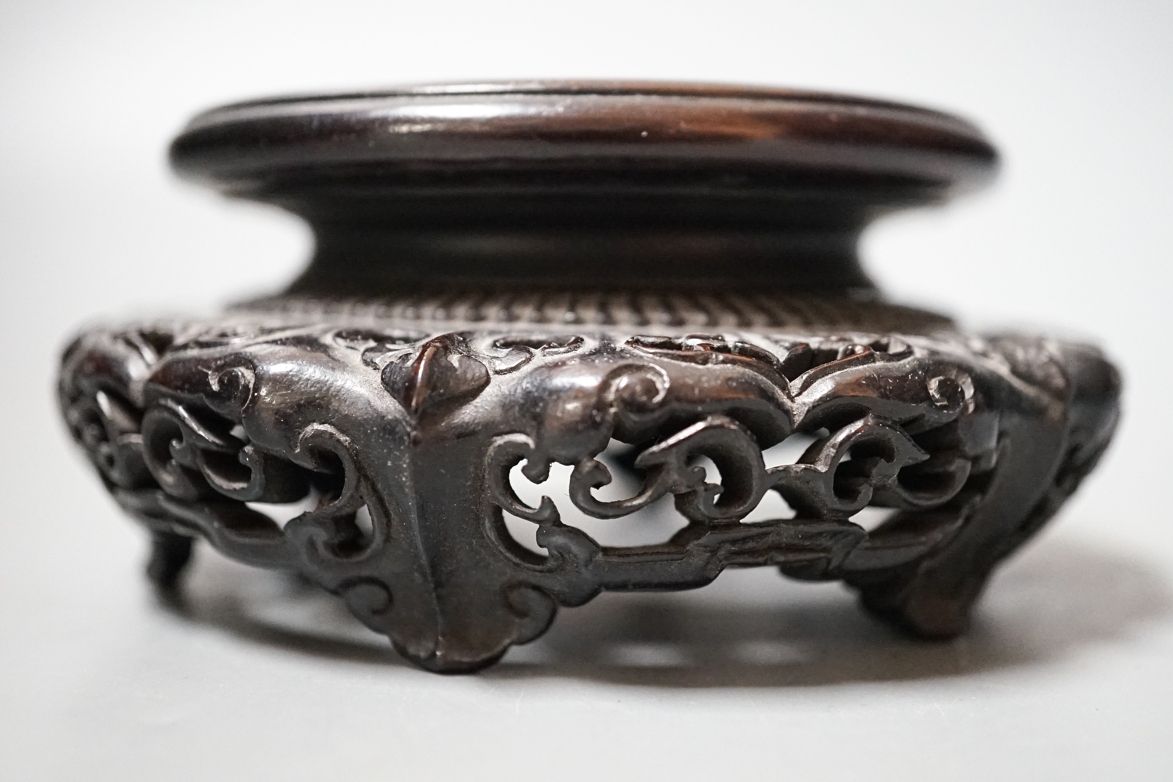 A fine 19th century Chinese hardwood stand, 11.4cm diameter